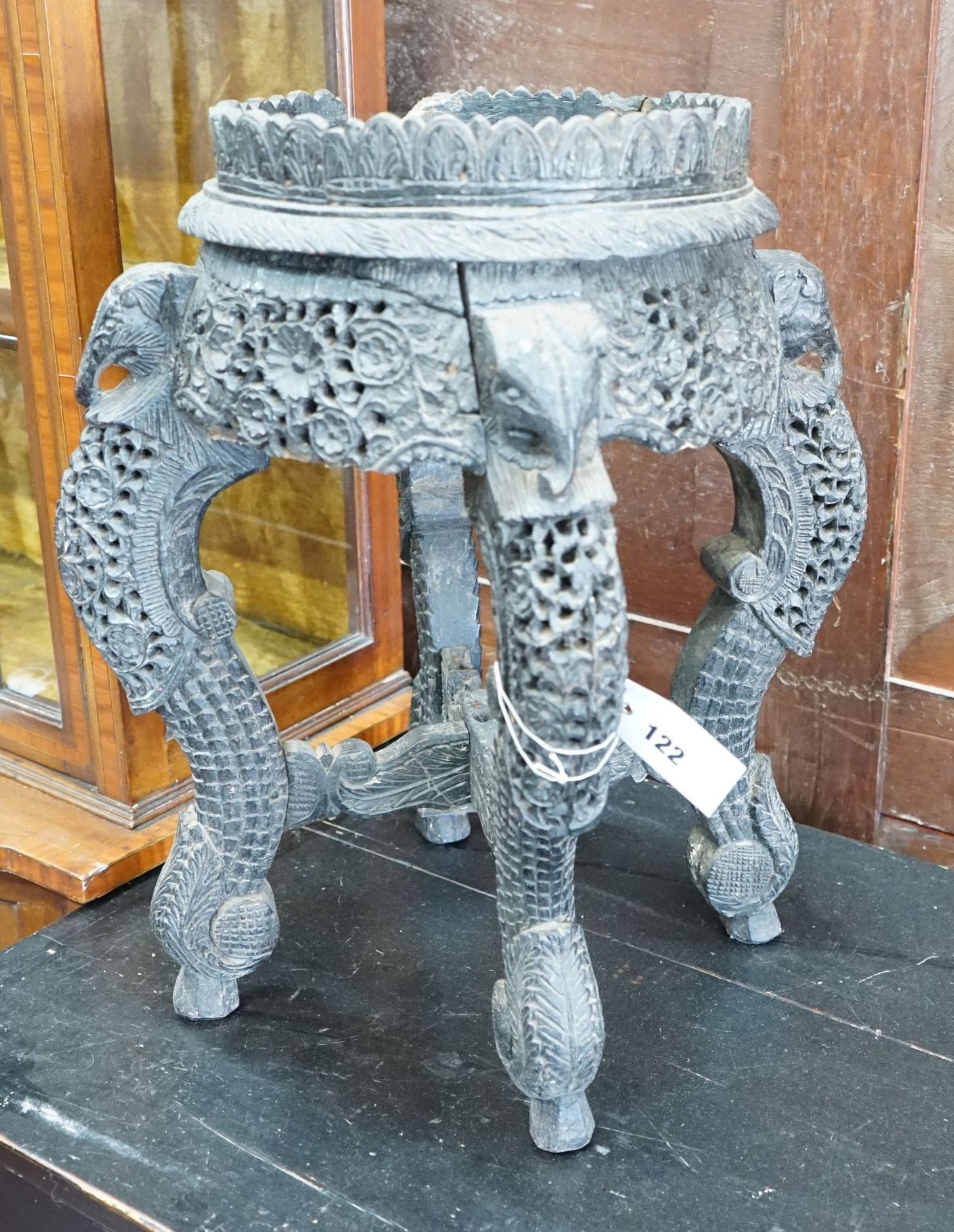 A Burmese carved hardwood jardiniere stand, width 32cm, height 49cm